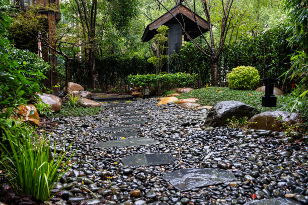A beautifully scenic garden filled with rustic elements and cozy homes, all surrounded harmoniously by nature