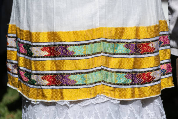 A traditional Ethiopian kemis, a white dress with colorful embroidery, worn by women during the celebration of the Jewish holiday of Sigd.