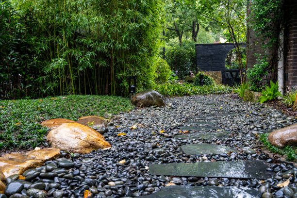 istock Decorative sprinkling of flowerbed paths with pebbles 2177595506