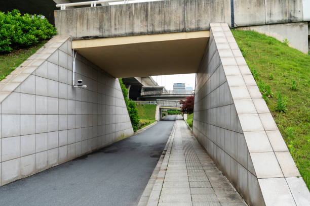 Concrete structure and asphalt road space under the overpass in the city