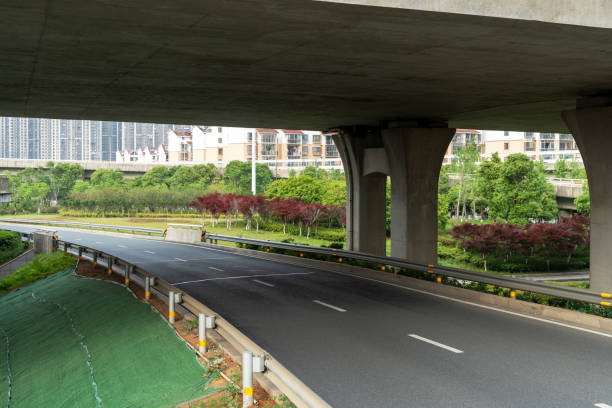 istock Concrete structure and asphalt road space under the overpass in the city 2177597337
