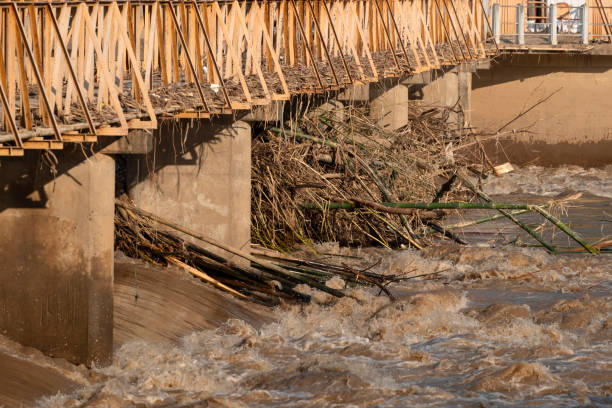 istock Debris from the violent flash floods stuck to the bridge. 2177597563
