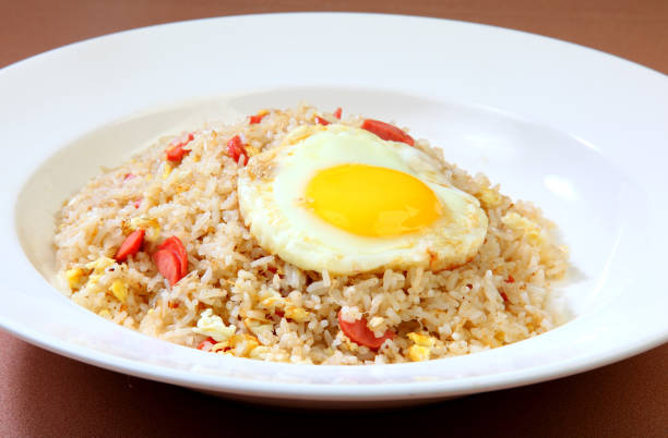 istock delicious ham chicken, egg, fried rice in white plate on brown background premium western cafe halal food menu for restaurant 2177598335