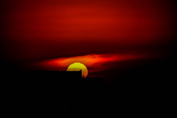 istock A sunset with a large sun in the sky 2177601919