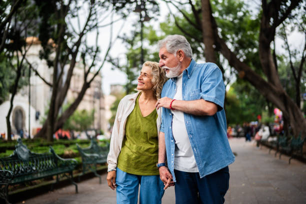 istock Senior couple talking and walking outdoors 2177602673