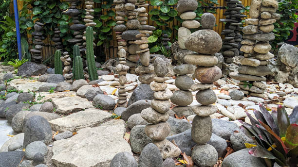 istock A zen garden with stacked stones, surrounded by cacti and bamboo 2177606509