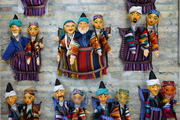 This image features two beautifully carved wooden figurines of traditional Thai musicians, dressed in detailed cultural attire. Their delicate expressions and handcrafted details highlight Thai artistic heritage and craftsmanship. The warm tones and soft lighting create a serene and inviting atmosphere, making this image ideal for Thai restaurant decor, cultural photography, or branding related to traditional arts and heritage-inspired interior design.