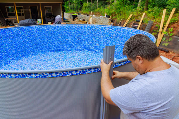 istock Worker installation metal frame of above ground pool is a underway 2177618751