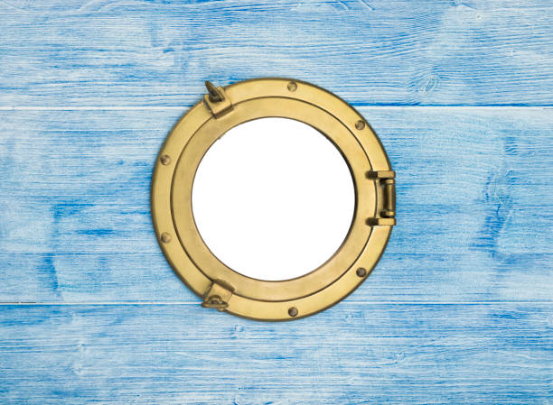 istock Brass porthole in blue wooden wall 2177619640