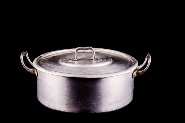 istock A silver pot with a lid sits on a black background 2177619768