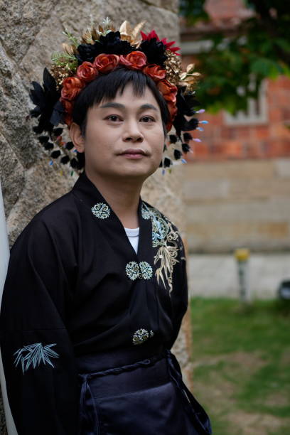 A man in an ancient costume is enjoying the scenery