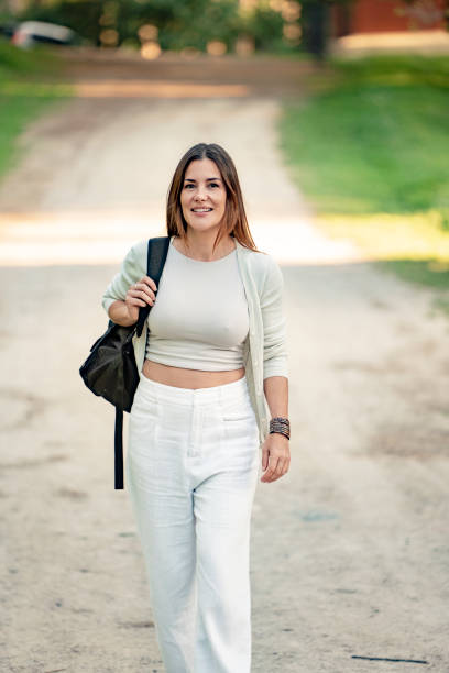 istock Attractive woman walking on a path in the park 2177620341
