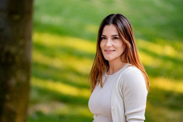 istock Smiling woman enjoying spring day in the park 2177620359