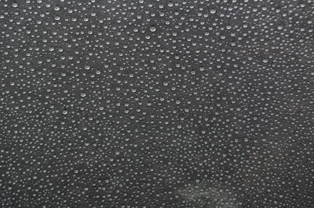 istock Small rain droplets on dark cover background 2177620852