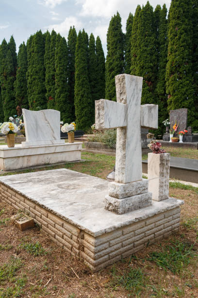 istock granite tombstones in cemetery with flowers 2177621453