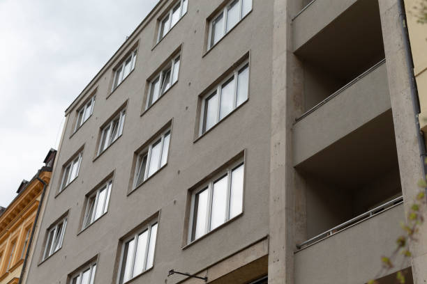 istock A large building with many windows and balconies on a cloudy day 2177621716