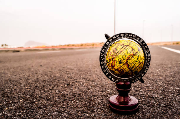 istock A globe is sitting on a road 2177623153