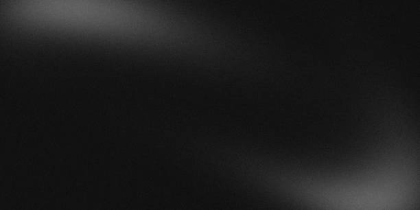 istock Noisy color gradient background grainy. Monochrome noise texture abstract black and white gradient with soft blur. banner, poster header backdrop design. 2177623634