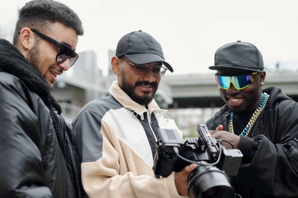 istock Assessing Camera Footage with Colleagues in Outdoor Setting 2177626144