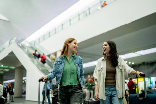 istock Friends talking at airport 2177626683