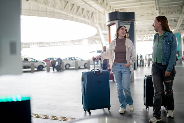 istock Friends talking at airport 2177626736