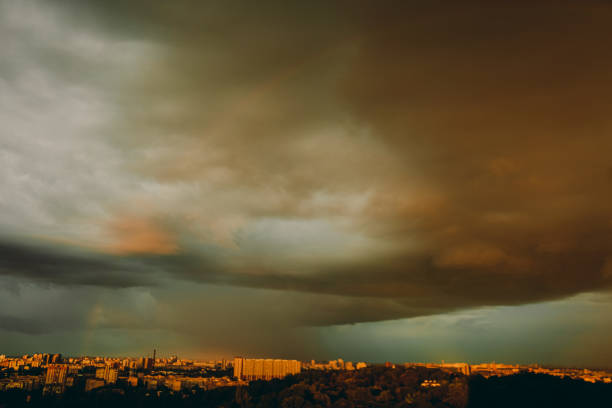 Evening city in storme weather. Thunderous clouds