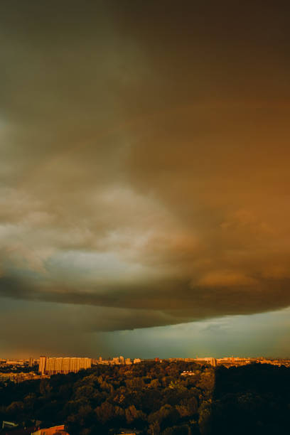 Evening city in storme weather. Thunderous clouds