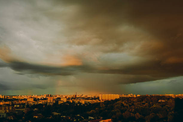 Evening city in storme weather. Thunderous clouds