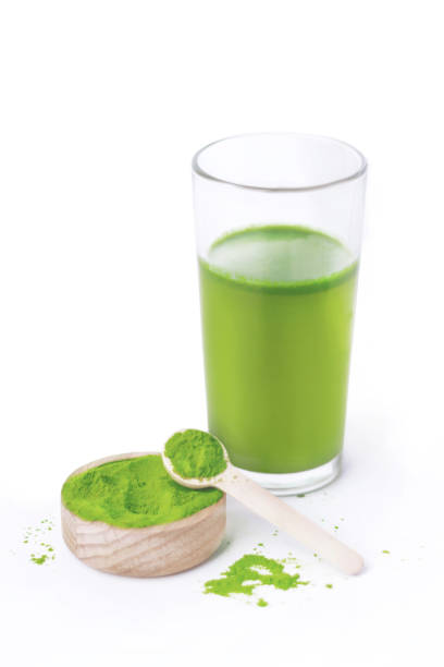 istock Glass with fresh wheatgrass juice on white background vertical photo 2177628623