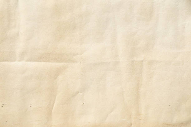 istock Crumpled Old yellow paper with folded crease 2177631526