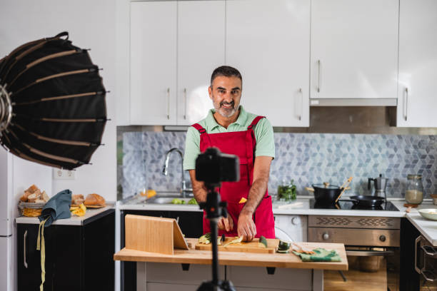 istock Senior chef recording cooking show at home using camera 2177632897