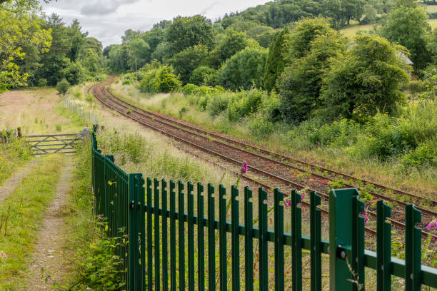 Train tracks and fence in countryside near Bodmin, England