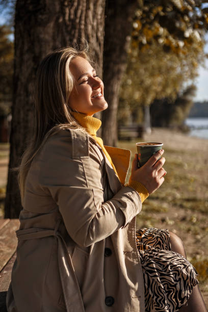 istock Woman Enjoying Coffee on a Bright Day 2177641046