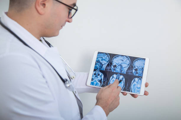 istock Male specialist doctor analyzing X-ray image in digital tablet 2177642545