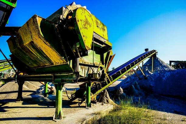 istock A large green machine sits on a pile of dirt 2177644494
