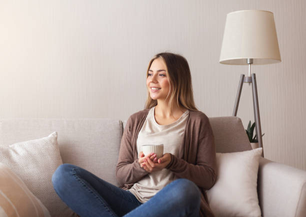 istock Young woman enjoying hot coffee at home 2177649320