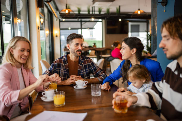 istock Friends hanging out at the cafe. They drink and talk. 2177650185