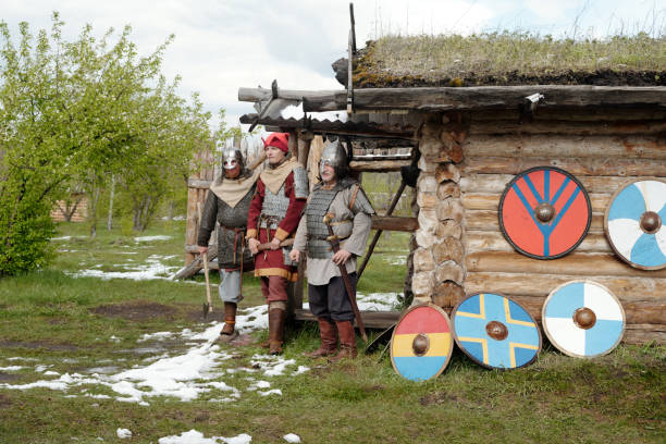 istock Reenacting Medieval Warriors Outside Wooden Hut 2177650669