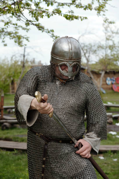 istock Medieval Warrior Holding Sword in Battleready Position 2177650743