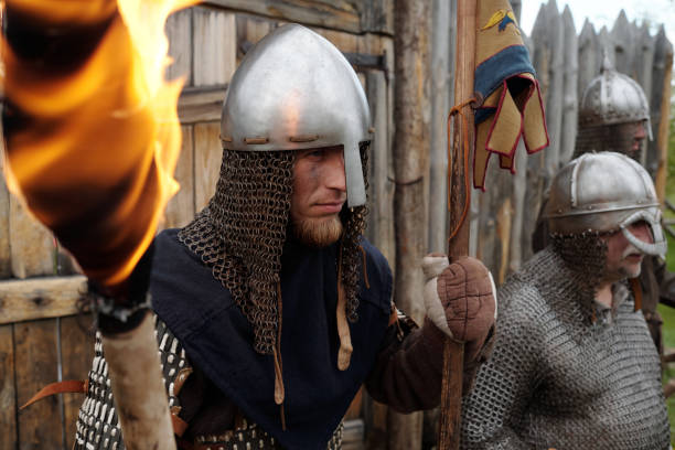 istock Reenactors Wearing Medieval Armor Holding Torches in Fort 2177650757