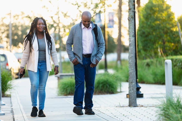 istock African-American father walks daughter to school 2177650974