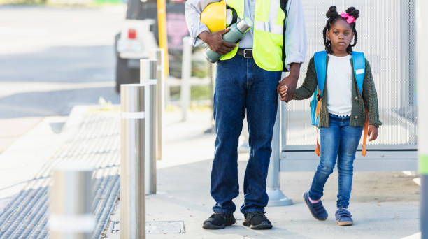 istock Father takes daughter to school, holding hands 2177651045