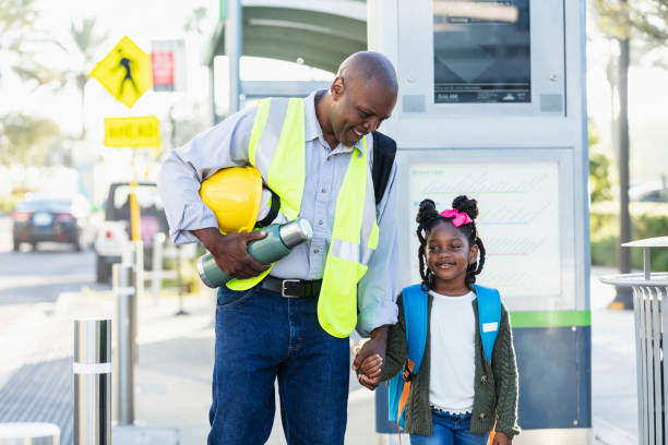 istock Father takes daughter to school, holding hands 2177651047