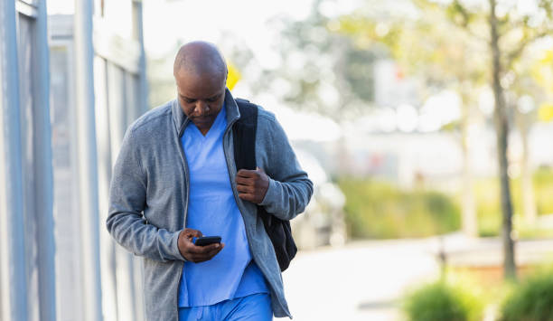 istock Healthcare worker going to work, with mobile phone 2177651071