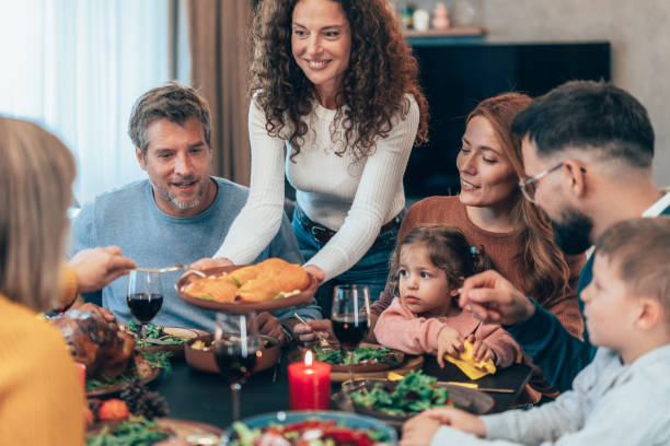 istock Family enjoy Thanksgiving lunch together 2177653755