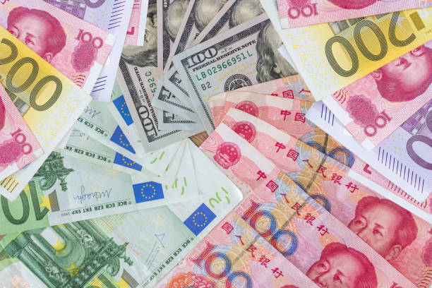 istock US dollar and Euro, yuan  banknotes as background 2177656513