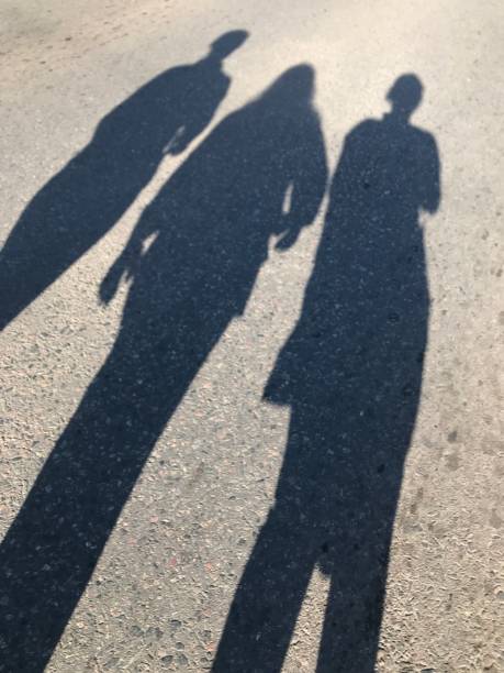 istock shadow of three women walking on pilgrimage to Lujan 2177656793