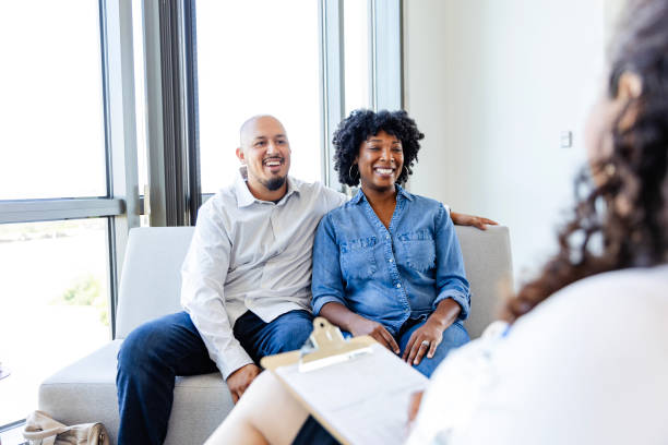 istock Diverse couple meets unrecognizable female social worker for adoption interview 2177657264