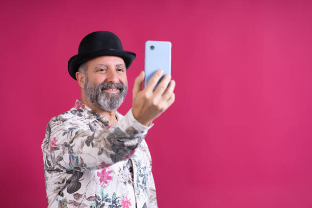 istock A man is taking a selfie with a cell phone 2177658192
