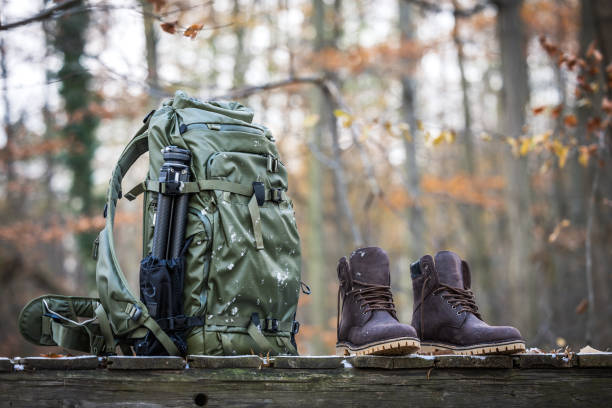 istock Hiking gear with leather ankle boots, waterproof backpack and tripod 2177659343